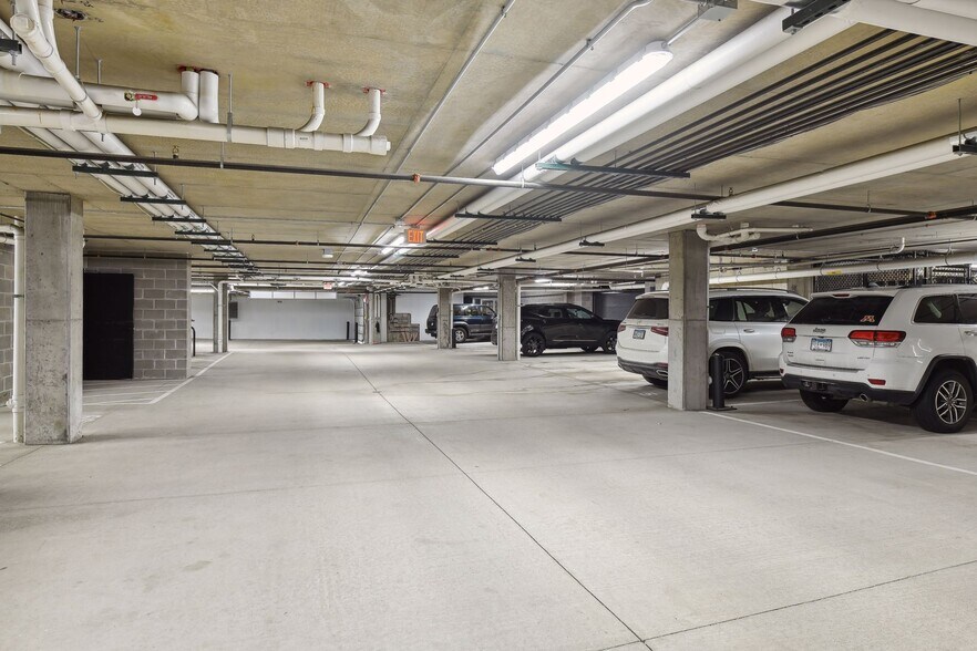 Two parking stalls and a storage locker in the heated garage come with this unit - 222 Ferndale Rd S