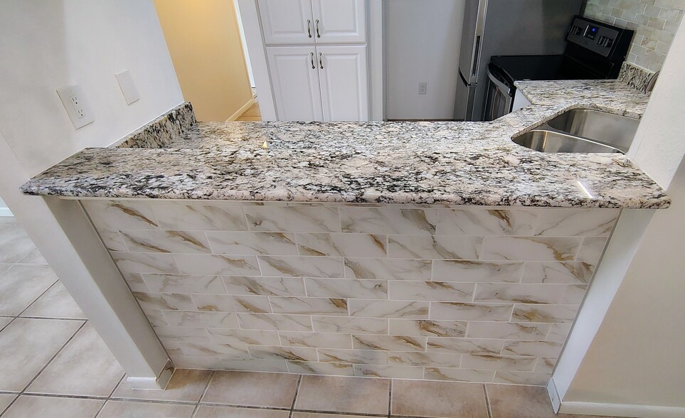 Porcelain tiles on bar wall - 1353 Pine Ridge Cir E