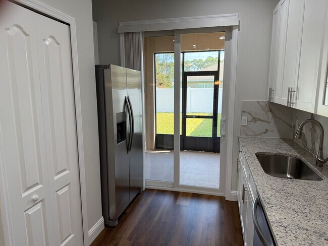 Building Photo - Brand New 3 Bedroom, 2 Bathroom Townhome with 1-Car Garage, Screened Porch & FULLY PRIVATE Fenced...