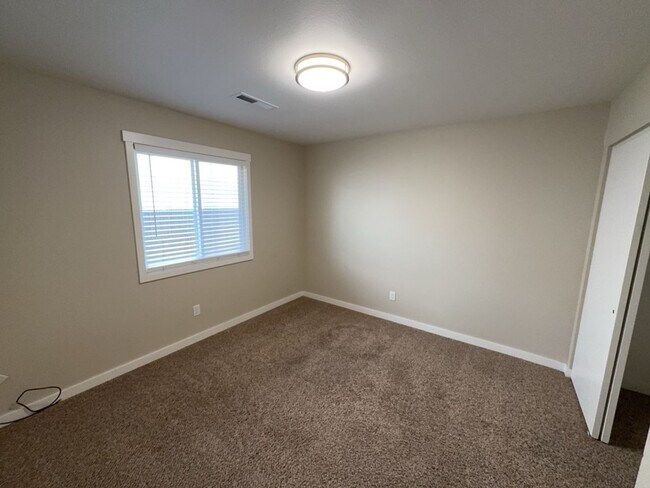 Building Photo - Newley updated 3-bedroom home features fenced yard, garage, and covered patios!