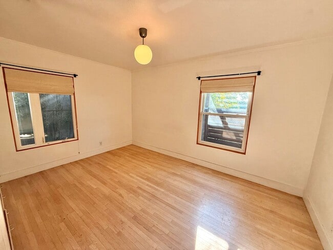 Building Photo - Hilltop Highland Park Sanctuary with Views, Private Gated Yard, In Unit Laundry, Parking & Abunda...