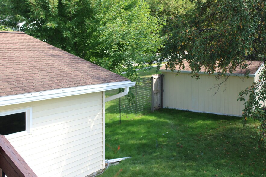 from deck overlooking fenced back yard - 3991 Whiting Ln NE