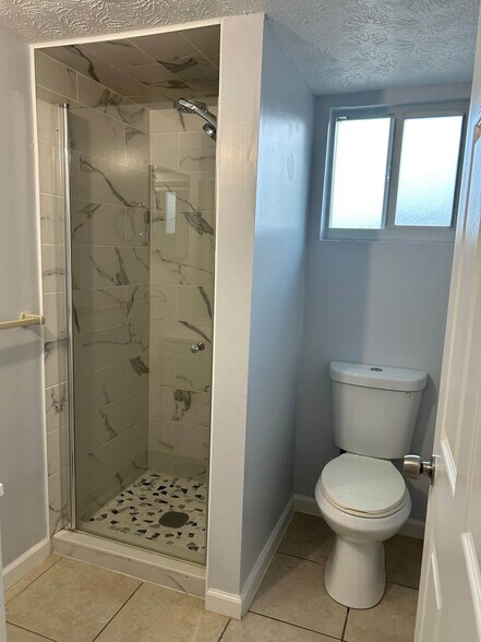 Beautiful new tile shower! - 7669 SE James St