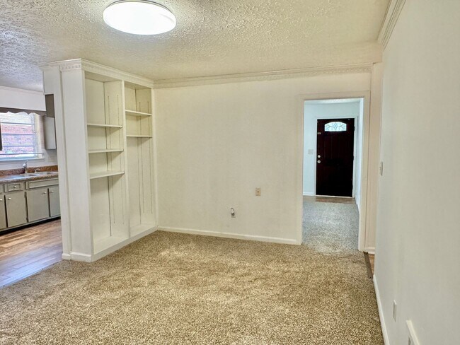 Building Photo - Cozy Meets Spacious: 4BR/2BA with Bonus Den & Patio