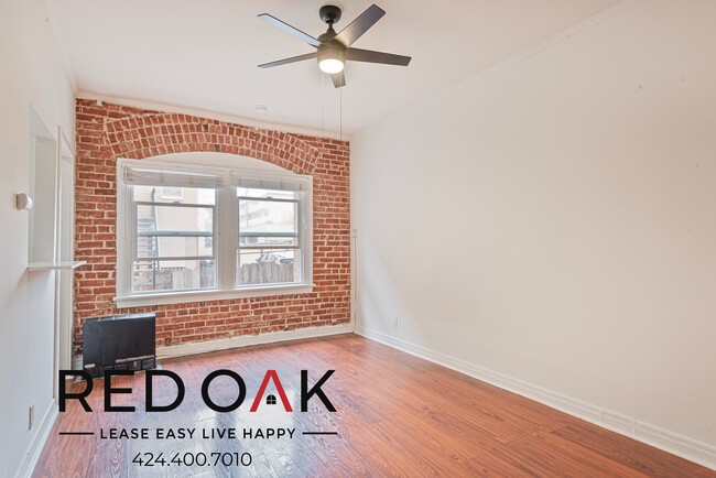 Building Photo - Welcoming Studio with Exposed Red Brick, H...