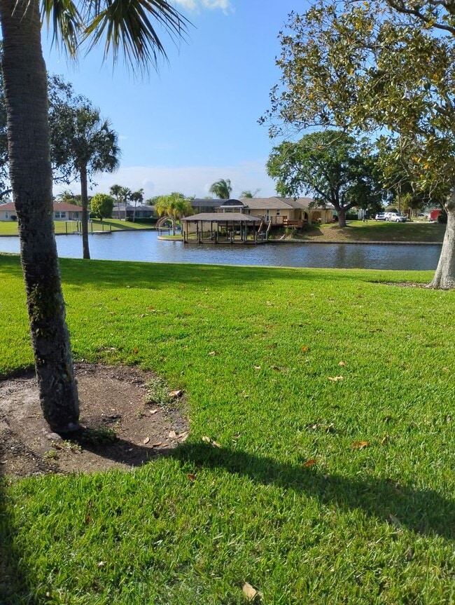 Building Photo - FULLY FURNISHED 2-Story Townhouse on Canal – Pool, Golf Views & ALL Utilities Included!