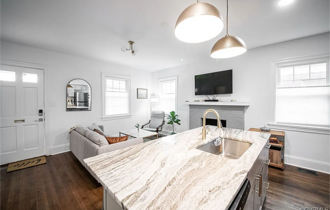 Open concept living and kitchen area. - 309 E Brookland Park Blvd