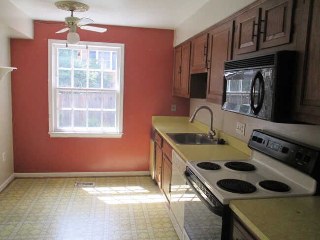 Building Photo - SPACIOUS BRICK TOWN-HOME