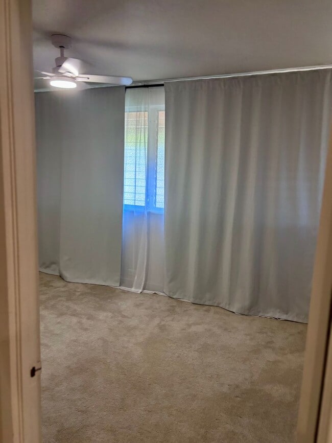 Building Photo - Available Now | 2 Bedroom, 2 Bathroom Townhouse with 1 Assigned Parking Stall at Tropic Gardens 1