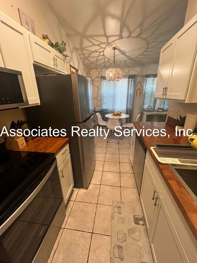 Building Photo - Beautifully furnished  2-Bedroom Duplex – ...