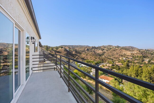 Building Photo - Modern Elegance Meets Scenic Privacy in Be...