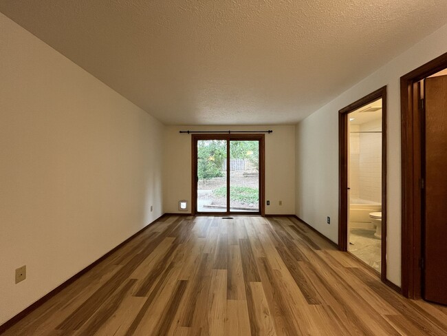 Building Photo - Spacious 3-Bedroom Home with Custom Stone Fireplace, Attached 2-Car Garage & Expansive Backyard i...