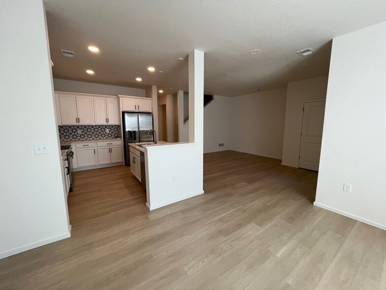 Open space living room, dining room and kitchen - 5030 McKinnon Ct