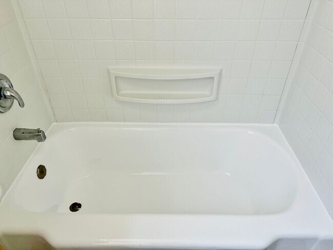 Building Photo - Crisp Duplex, offstreet parking, great backyard too.