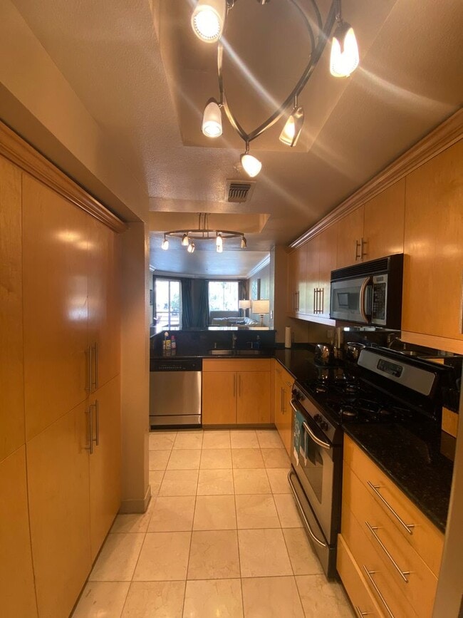 Building Photo - Fully furnished 2 bedroom unit in 24/7 guard gated community