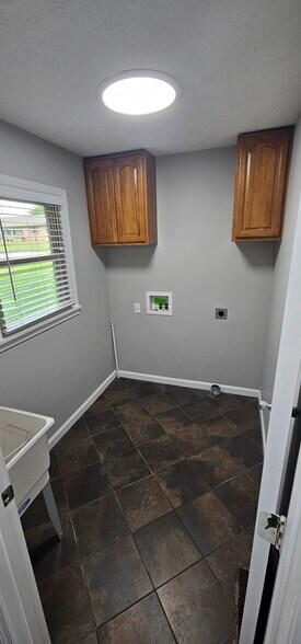 Laundry room with utility sink - 901 Hurst Dr