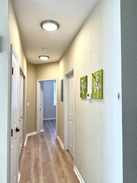 Hallway leading to 2nd bedroom. - 8412 S Holland Ct