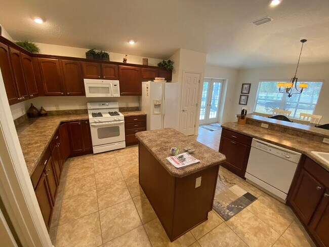 Building Photo - SEASONAL RENTAL. Large 4 Bed + 4 1/2 Baths Home, w/Views of the Jacaranda Golf Course and Lake in...