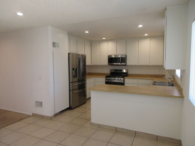 Building Photo - Duggan Property Management, Inc presents  *Reduced*  Canoga Park- 3BD 2.5BA