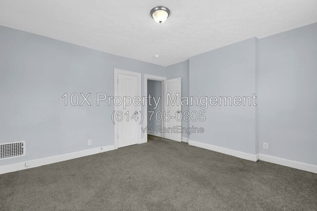 Building Photo - 1311 E 24th Ave