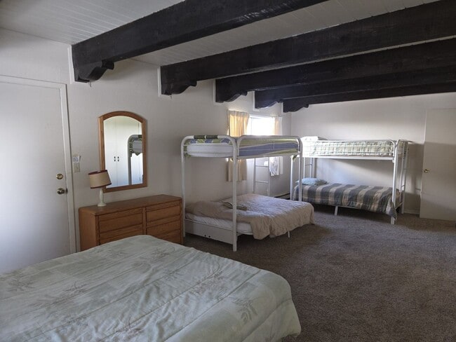 Building Photo - Unique open design,wood beams in all rooms-Very cheery and cozy. Newly remodeled, and newly furni...