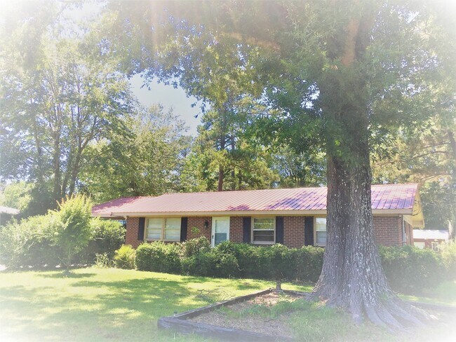 Primary Photo - Cottage style brick ranch home, carport, f...