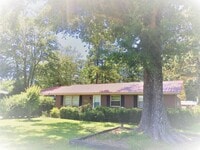 Building Photo - Cottage style brick ranch home, carport, f...