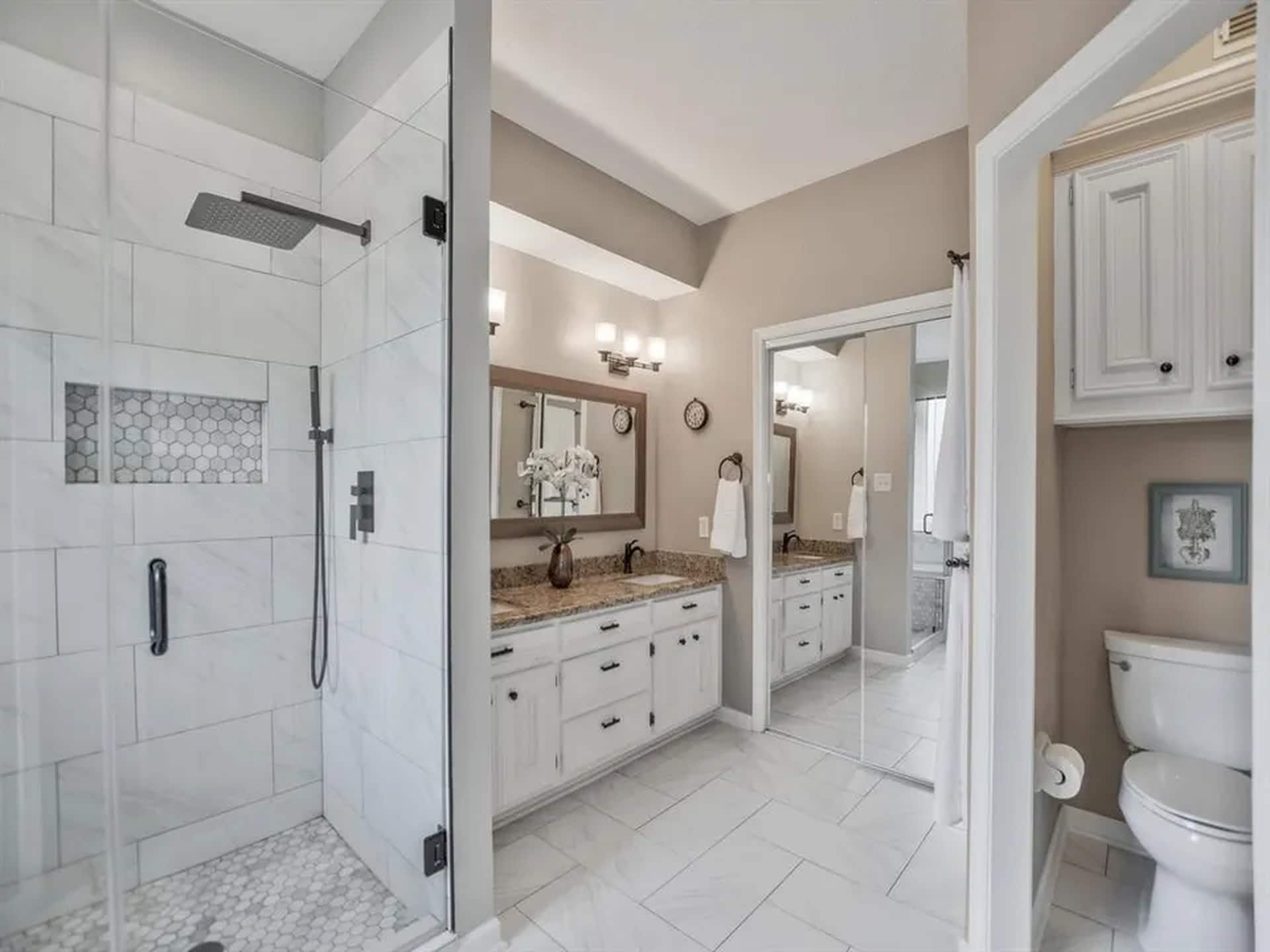 spacious primary closet through the bathroom - 6035 Spring Creek Grove Ln