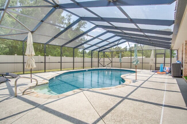 Building Photo - Milton 4BR Pool Home with Office, Vaulted Ceilings, Screened Saltwater Pool & 2-Car Garage