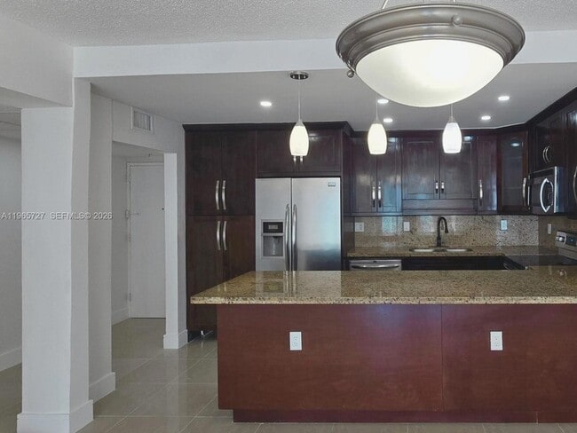 Building Photo - 19380 Collins Ave
