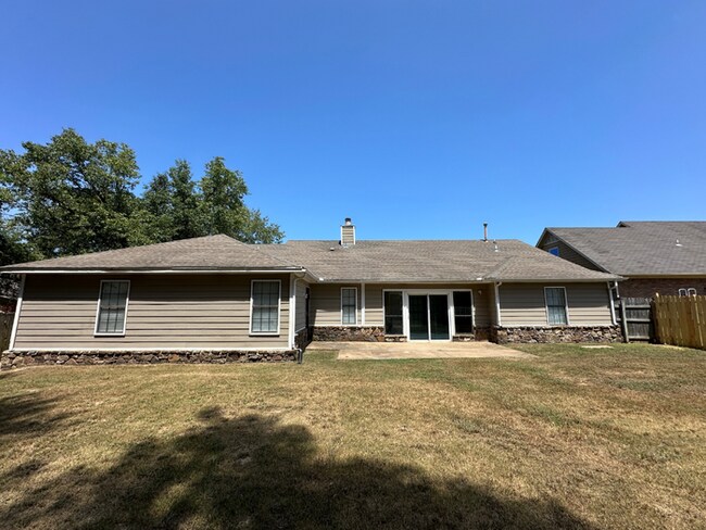 Building Photo - Grand 4BR/2BA Near Southwind | 2,438 Sq Ft, Stone Fireplace, Soaking Tub & 2-Car Garage