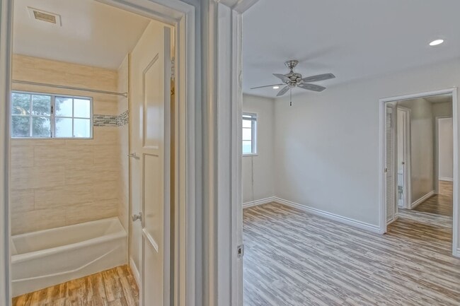 Building Photo - CHARMING & AIRY HOME W/ SPACIOUS FENCED YARD & LARGE 2-CAR GARAGE CLOSE TO SCHOOLS, SHOPPING & MI...