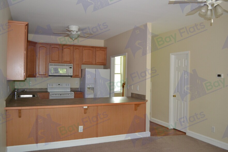 Kitchen with bar. - 41195 Friendship Ct