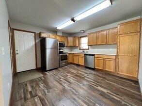 Building Photo - Spacious 3BR Duplex with Finished Basement & 2-Car Garage in Otsego