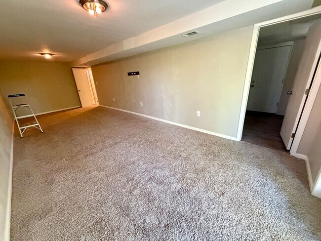Building Photo - Modern Comforts Await: Spacious Rental with 2-Car Garage, Private Office, and Finished Basement w...