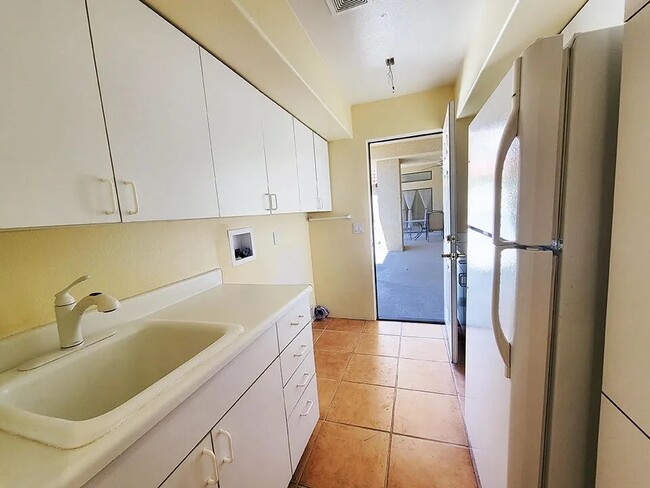 Laundry room with second refrigerator - 72836 Mesa View Dr