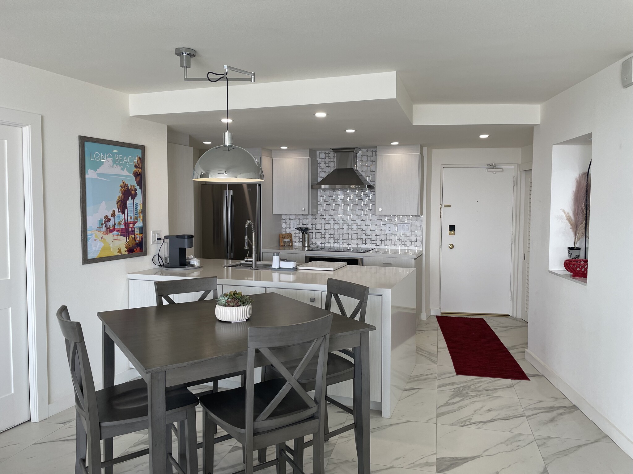 Dining room facing front door - 700 E Ocean Blvd