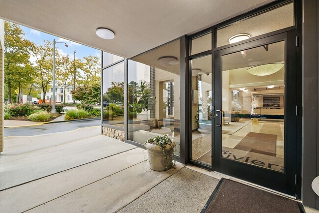 Building Photo - Spacious, and Sunlit 1 BD/1 BA Condo w/Reserved Garage Parking and Utilities Included in Chevy Ch...