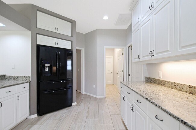 Building Photo - Annual rental: Spacious 3BR/2BA Creekwood Home with Office, Screened Lanai, EV Charger & Resort-S...