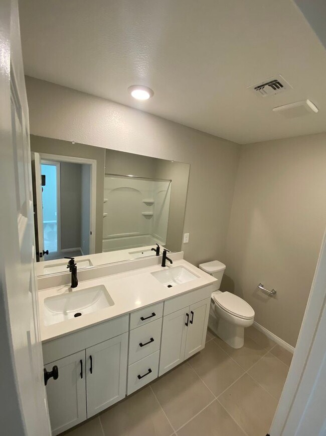 Building Photo - Americana Property Mgmt - 2022 built 4 bedrooms in prime South West Las Vegas