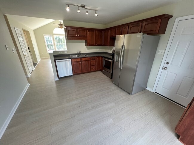 Open Kitchen with brand new appliances - 11810 White Pine Dr