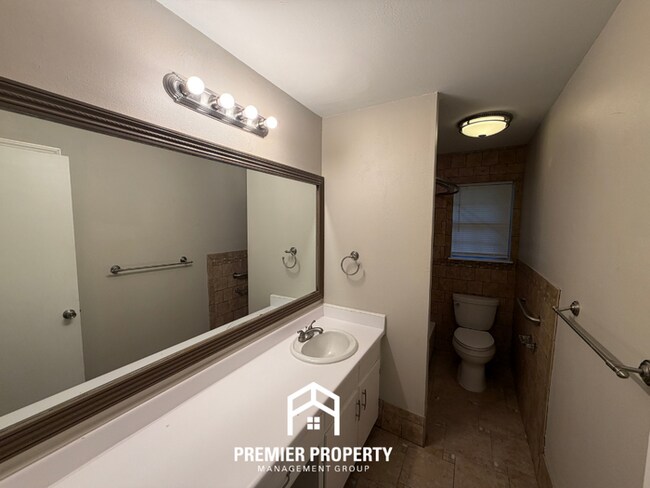 Building Photo - Charming 3BR/2BA Northport Home with Hardwood Floors & Brick Fireplace!