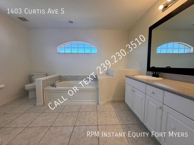 Building Photo - 1403 Curtis Ave S