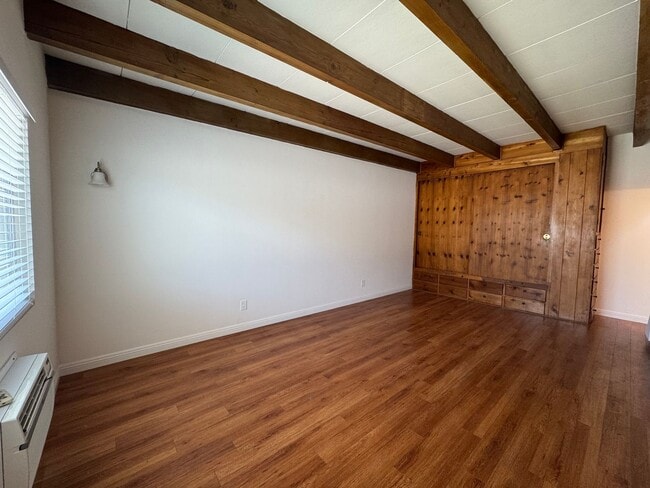Building Photo - Large and Bright Studio with wood ceiling beams and floors...