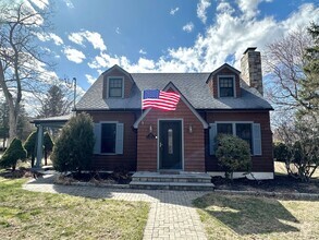 Building Photo - Charming Cape Cod Home with Updated Kitche...