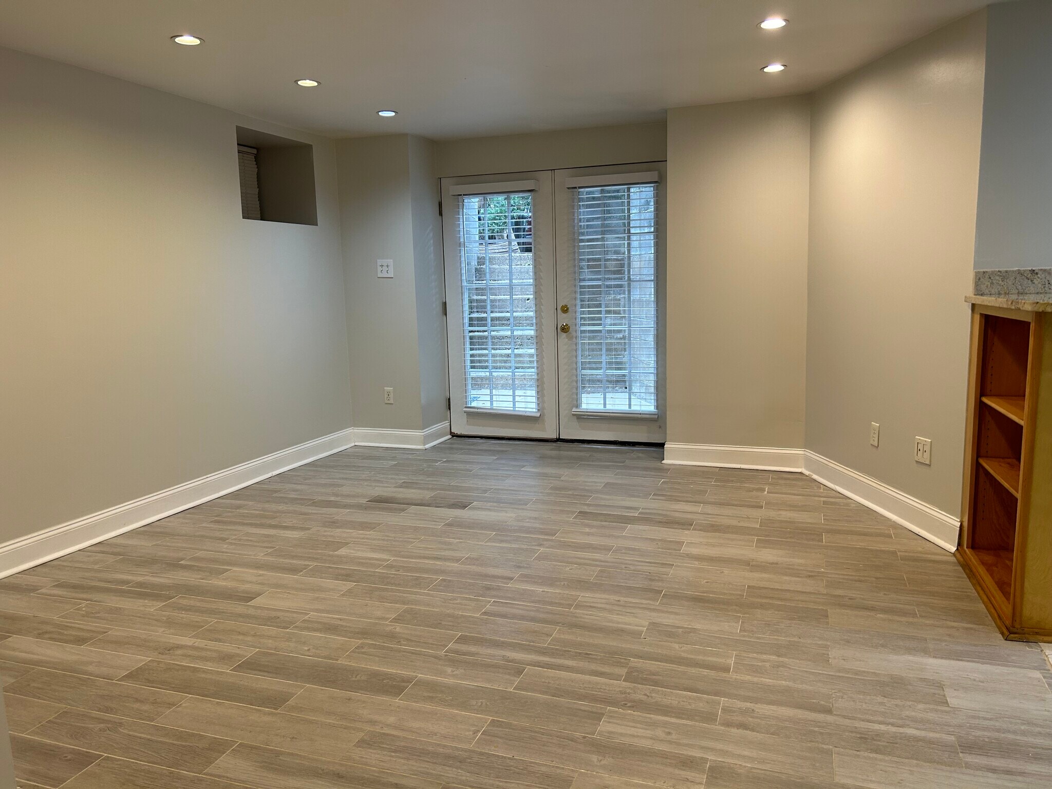 Living Room - French doors to patio - rear apartment entrance - 707 College Ave