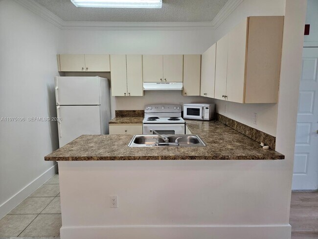 Building Photo - 18324 NW 68th Ave