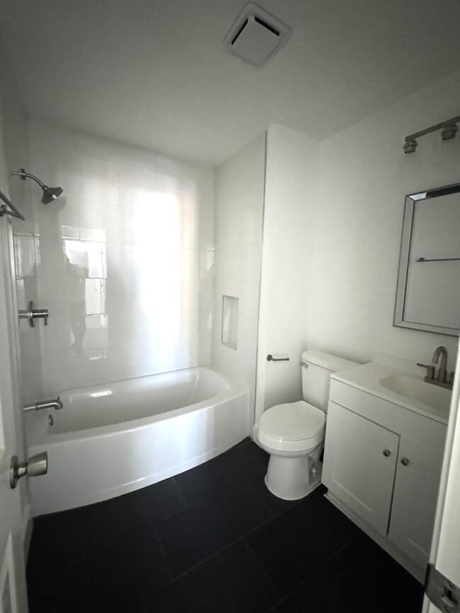 Building Photo - Completely Remodeled 2BR/1.5BA Townhome – City Convenience!