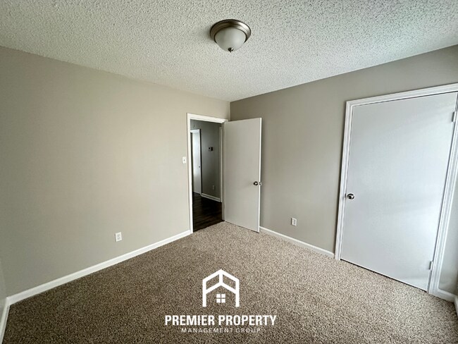 Building Photo - Quiet 3BR/2BA Cove Near Southwind | Soaring Ceilings & Floor-to-Ceiling Stone Fireplace