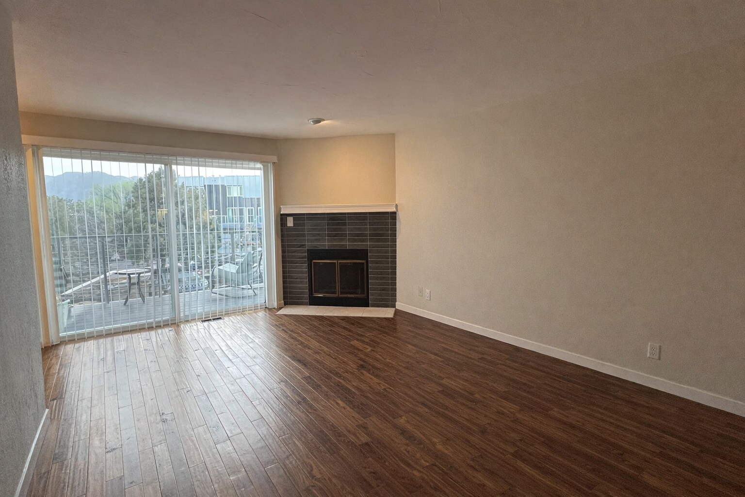 Open living space with a classic wood-burning fireplace. - 524 Superior St